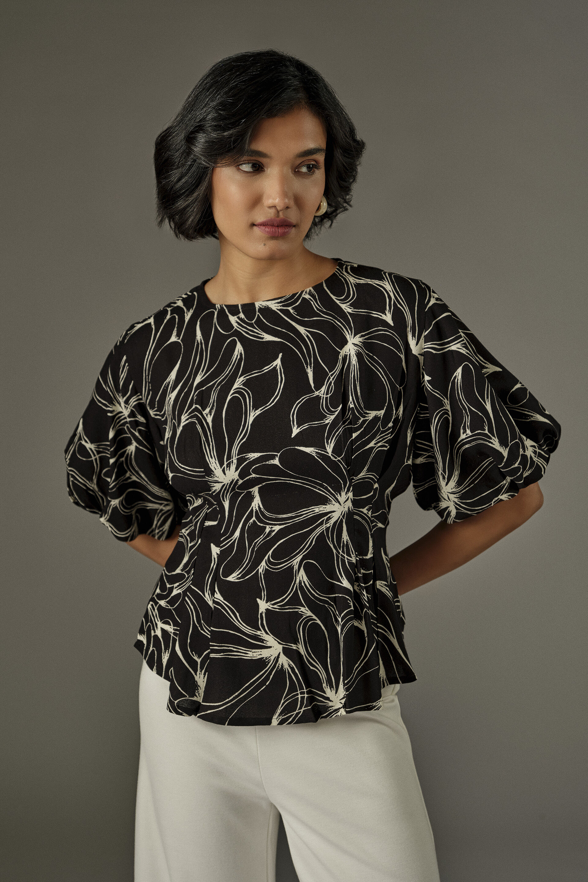 Abstract Florals Peplum Top in Black